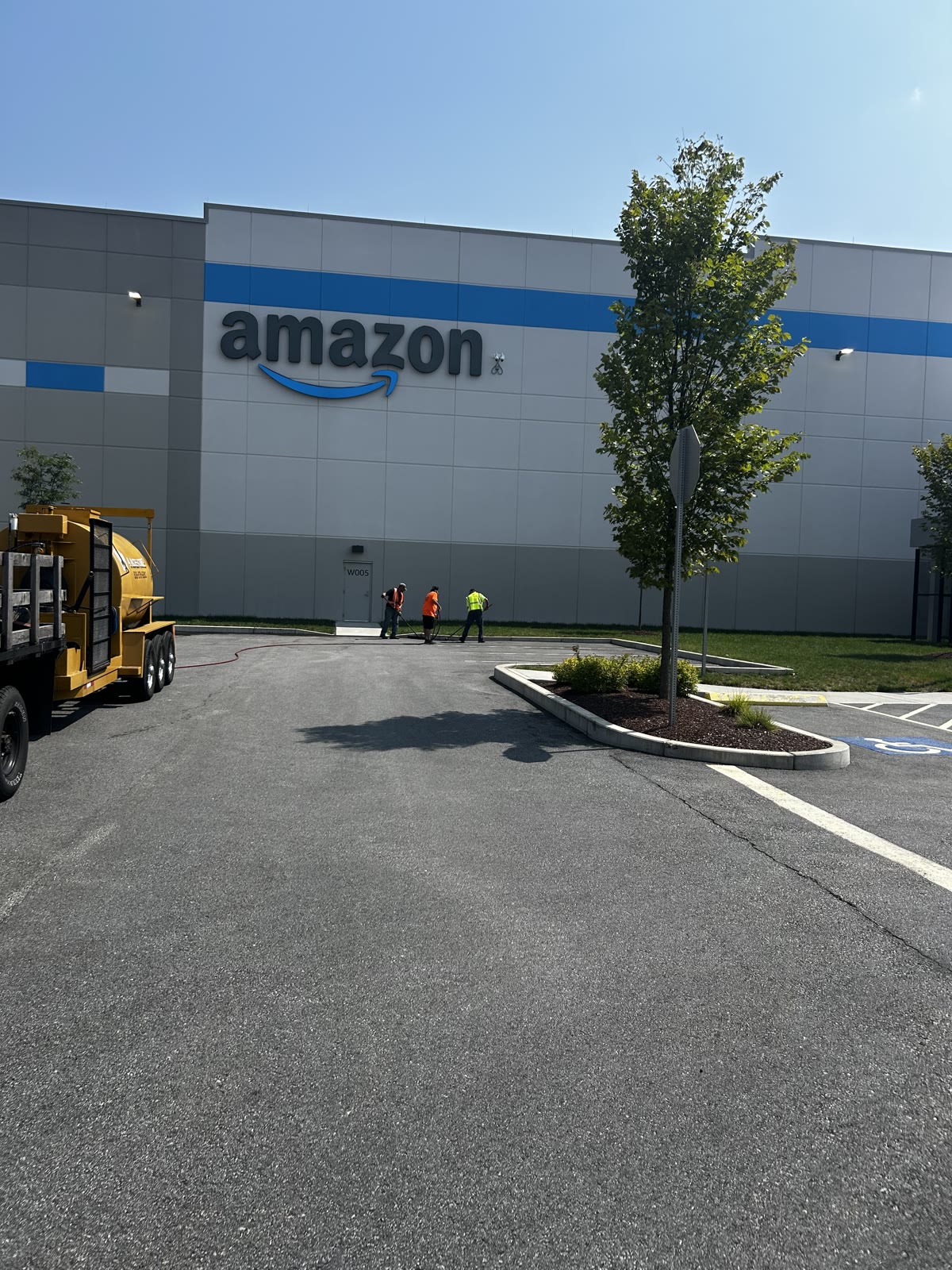 Sealcoating crew at a warehouse property